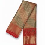 Kanchipuram tissue silk saree with a beige and grayish-brown body and a rust-colored border and pallu.