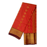 Kanchipuram soft silk saree orange featuring gold zari butta motifs with thick traditional gold zari border.