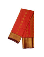 Kanchipuram soft silk saree orange featuring gold zari butta motifs with thick traditional gold zari border.