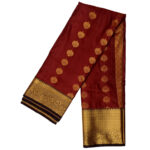 Kanchipuram soft silk saree maroon featuring gold zari butta motifs and a thick traditional gold zari border.
